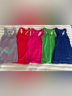Bundle of 13 women’s workout tank tops (sizes XS and SM)